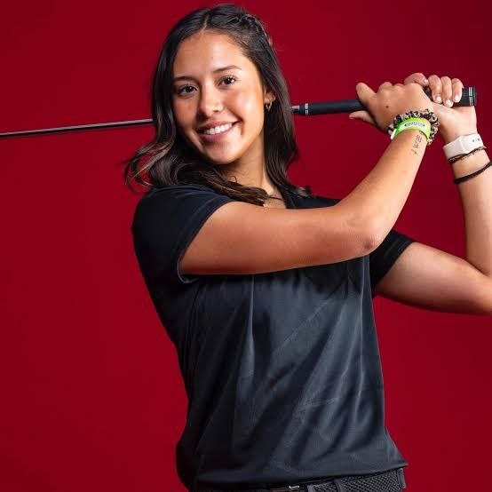 Alexa Melton holding a golf club