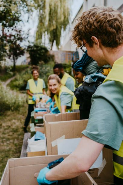 Volunteers packing food into boxes for community support