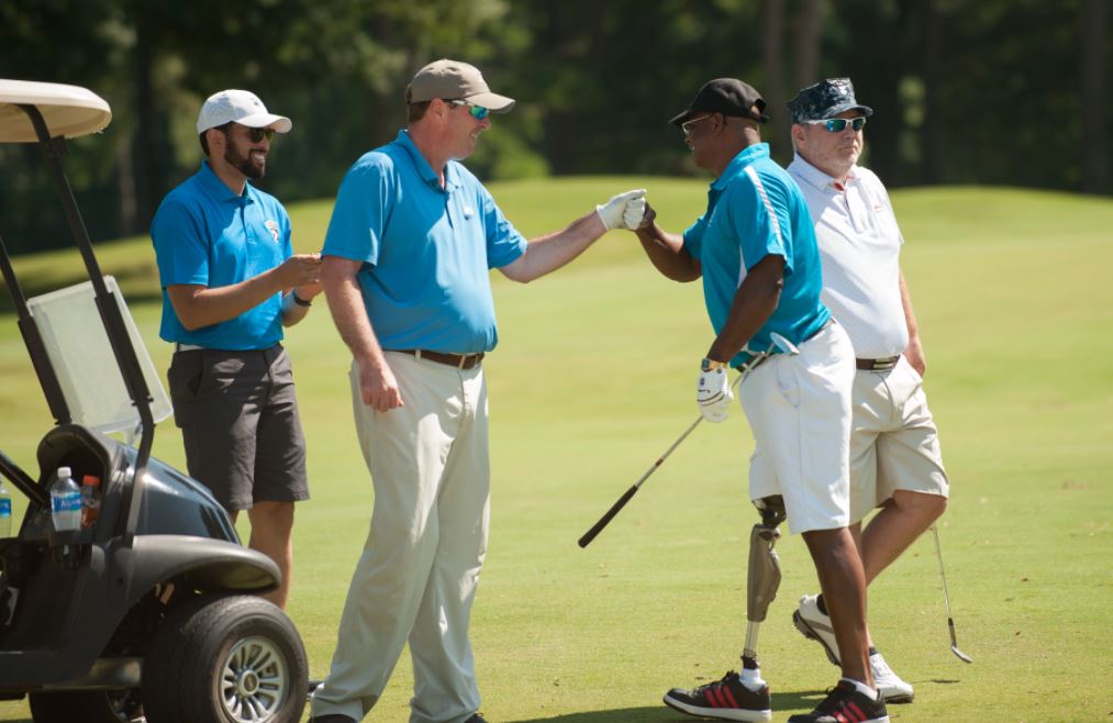 An inclusive golf community sharing a moment together